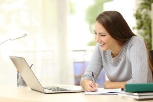 woman smiling while taking course