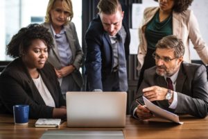 group of employees passionately working together